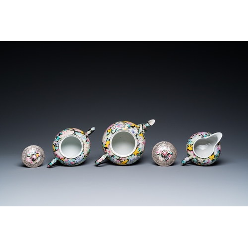 196 - A Chinese eight-piece silver-mounted famille rose millefleurs tea service, Qianlong mark 20th C.H.: ... 