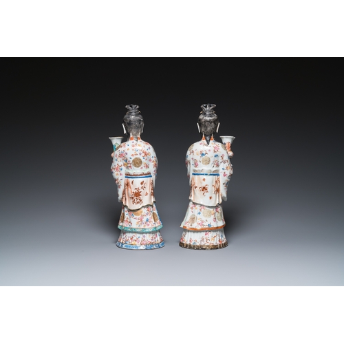 214 - A pair of large Chinese famille rose candle holders in the shape of Mandarin court ladies, QianlongH... 