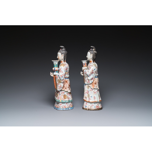 214 - A pair of large Chinese famille rose candle holders in the shape of Mandarin court ladies, QianlongH... 