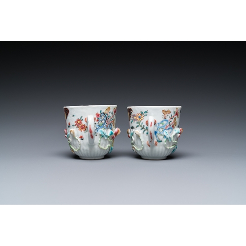 259 - A pair of Chinese famille rose relief-decorated cups and saucers, YongzhengDia.: 11 cm (the saucers)... 