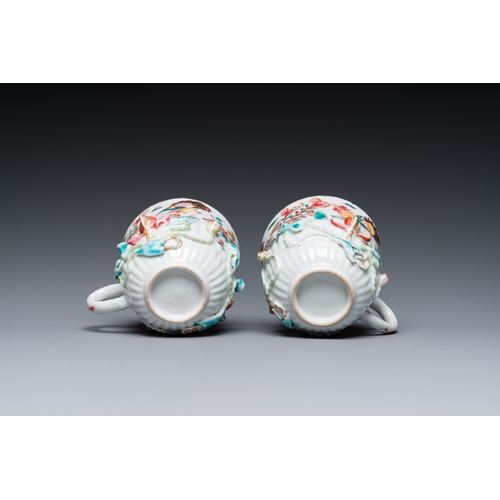 259 - A pair of Chinese famille rose relief-decorated cups and saucers, YongzhengDia.: 11 cm (the saucers)... 