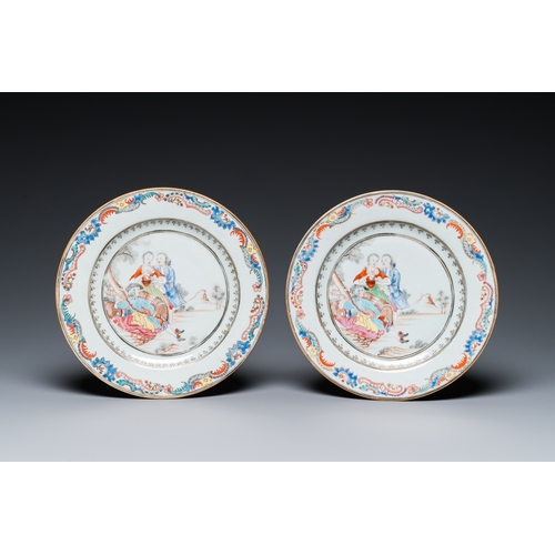 298 - A pair of fine Chinese famille rose plates with a musician playing in front of a couple, QianlongDia... 