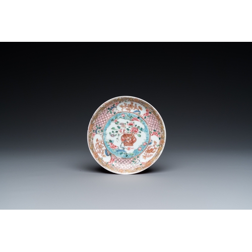 308 - A Chinese famille rose ruby-ground cup and saucer, YongzhengDia.: 11,5 cm (the saucer)Dia.: 7 cm - H... 