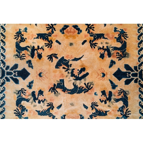 436 - A large Chinese Ningxia rug with dragons on a yellow ground, Tai He Tian å¤ªåæ®¿ mark, 19th C.Dim.... 