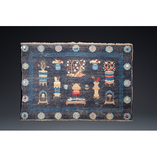 440 - A large Chinese blue-ground 'antiquities' rug, 19th C.Dim.: 264 x 183 cm (incl. frills)... 