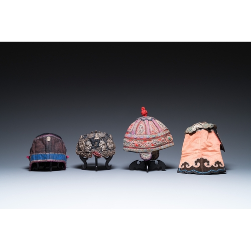 444 - Eight Chinese children's hats, 19/20th C.Dim.: 28 x 23 x 21 cm (the red hat)