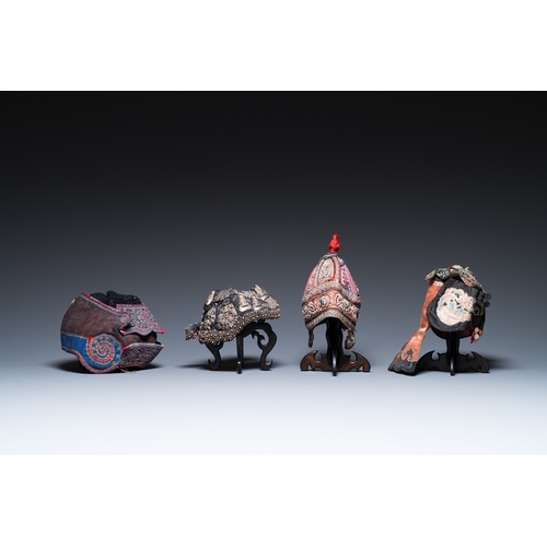 444 - Eight Chinese children's hats, 19/20th C.Dim.: 28 x 23 x 21 cm (the red hat)