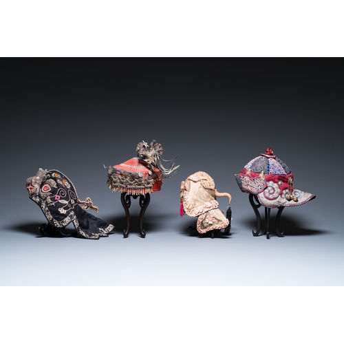 444 - Eight Chinese children's hats, 19/20th C.Dim.: 28 x 23 x 21 cm (the red hat)