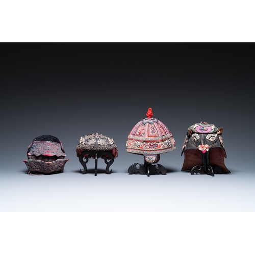 444 - Eight Chinese children's hats, 19/20th C.Dim.: 28 x 23 x 21 cm (the red hat)