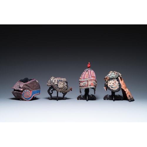 444 - Eight Chinese children's hats, 19/20th C.Dim.: 28 x 23 x 21 cm (the red hat)