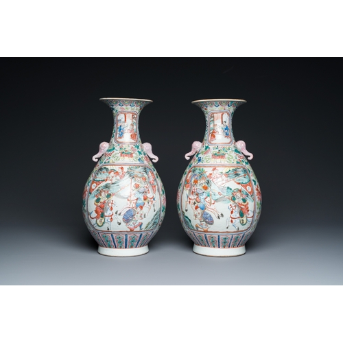 468 - A pair of Chinese famille rose vases with elephant handles, 19th C.H.: 40 cm