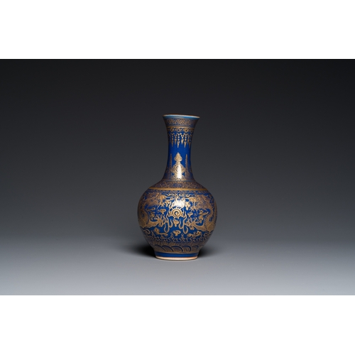 526 - A Chinese monochrome blue gilt-decorated 'dragons' bottle vase, Qianlong mark, 19th C.H.: 22 cm... 