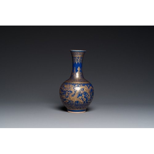 526 - A Chinese monochrome blue gilt-decorated 'dragons' bottle vase, Qianlong mark, 19th C.H.: 22 cm... 