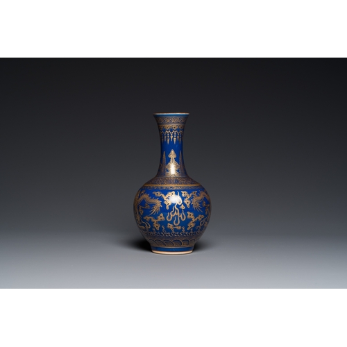 526 - A Chinese monochrome blue gilt-decorated 'dragons' bottle vase, Qianlong mark, 19th C.H.: 22 cm... 