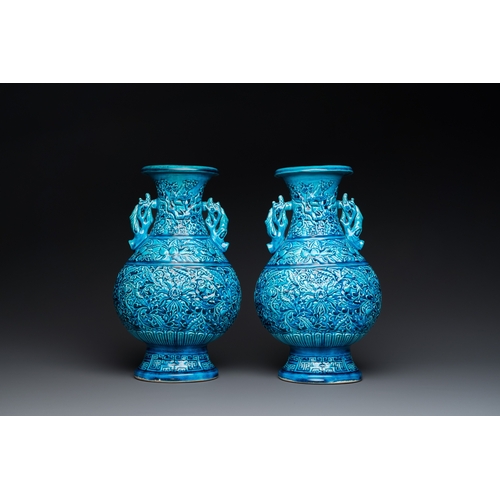 553 - A pair of Chinese turquoise-glazed 'lotus' vases, 19th C.H.: 30 cm