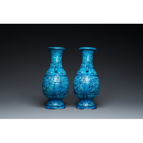 553 - A pair of Chinese turquoise-glazed 'lotus' vases, 19th C.H.: 30 cm