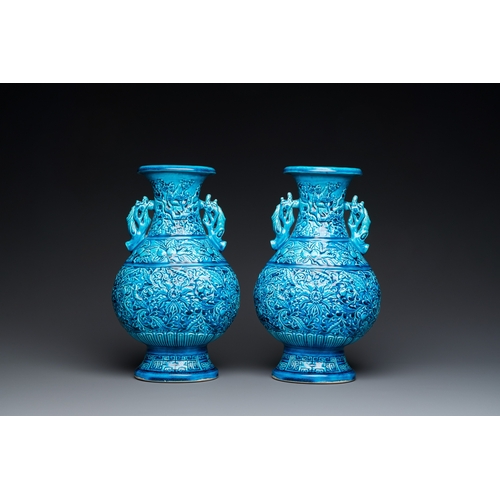 553 - A pair of Chinese turquoise-glazed 'lotus' vases, 19th C.H.: 30 cm