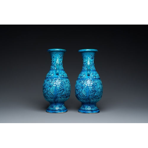 553 - A pair of Chinese turquoise-glazed 'lotus' vases, 19th C.H.: 30 cm