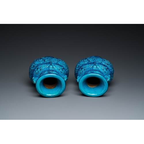 553 - A pair of Chinese turquoise-glazed 'lotus' vases, 19th C.H.: 30 cm