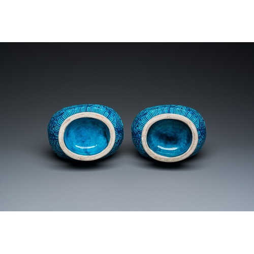 553 - A pair of Chinese turquoise-glazed 'lotus' vases, 19th C.H.: 30 cm