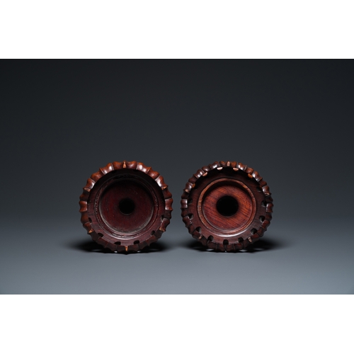 554 - A pair of Chinese monochrome celadon-glazed vases with underglaze design on wooden stands, Qianlong ... 