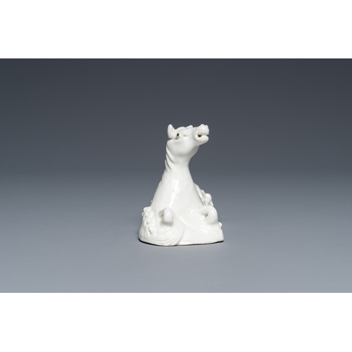 573 - A Chinese white-glazed brush rest in the shape of a resting horse in a wavy sea, 18th C.L.: 10,5 cm ... 