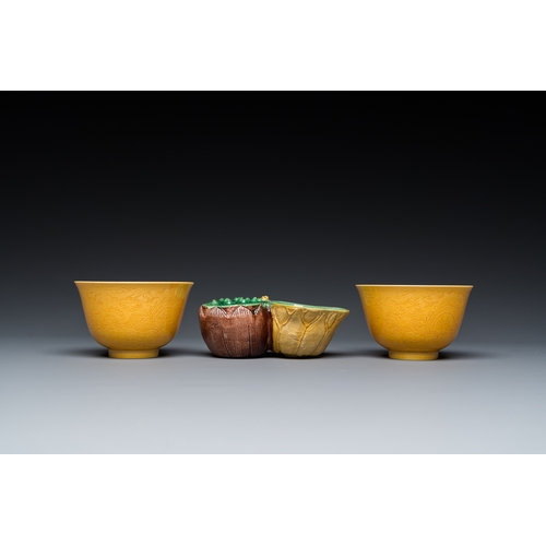 580 - A Chinese sancai-glazed water dropper and a pair of yellow-glazed anhua 'dragon' bowls, Xianfeng mar... 