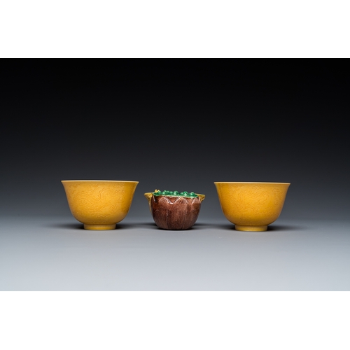 580 - A Chinese sancai-glazed water dropper and a pair of yellow-glazed anhua 'dragon' bowls, Xianfeng mar... 