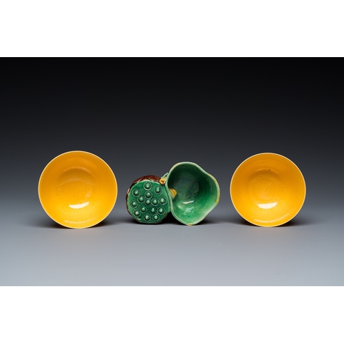 580 - A Chinese sancai-glazed water dropper and a pair of yellow-glazed anhua 'dragon' bowls, Xianfeng mar... 