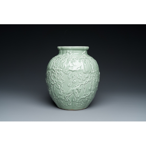 590 - A Chinese relief-molded monochrome celadon-glazed vase, 19/20th C.H.: 24,5 cm