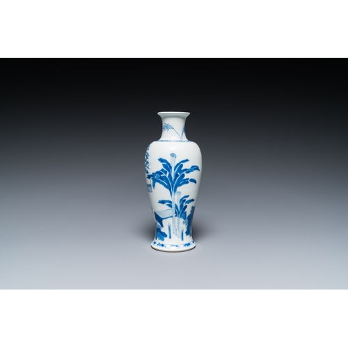 626 - A Chinese blue and white 'two ladies and a boy' vase, KangxiH.: 20,5 cm