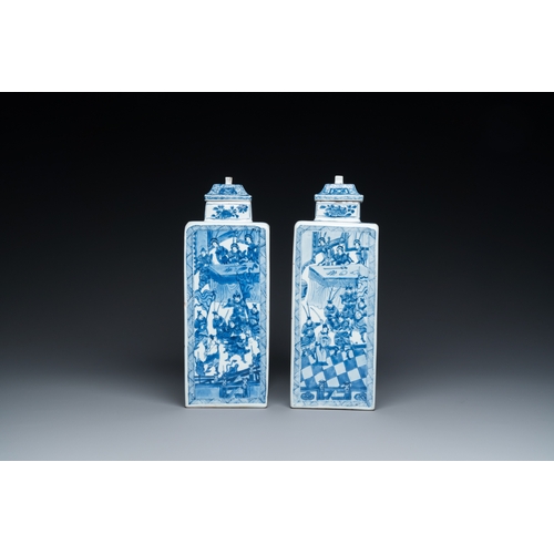 641 - A pair of Chinese blue and white square 'narrative subject' vases and covers, KangxiH.: 31 cm
 Ref.:... 