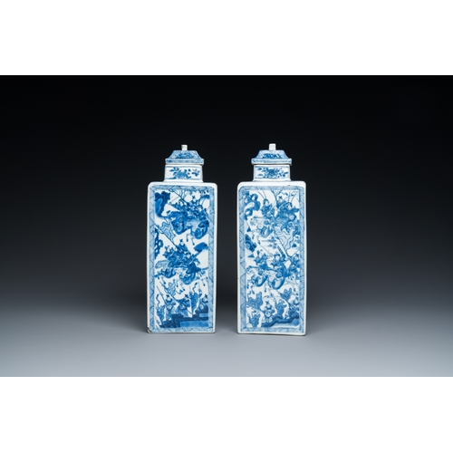 641 - A pair of Chinese blue and white square 'narrative subject' vases and covers, KangxiH.: 31 cm
 Ref.:... 