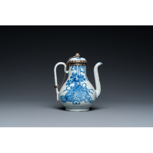 642 - A Chinese blue and white teapot and cover with silver mounts, KangxiH.: 13 cm