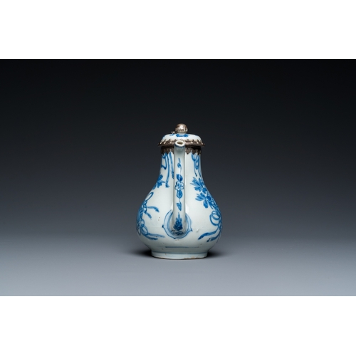 642 - A Chinese blue and white teapot and cover with silver mounts, KangxiH.: 13 cm