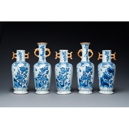 650 - A Chinese blue and white garniture of five vases with floral design, KangxiH.: 18 cm (the tallest)... 