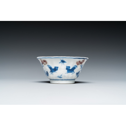 652 - A Chinese blue, white and copper-red cup and saucer, KangxiDia.: 12 cm (the saucer) Dia.: 7,5 cm - H... 