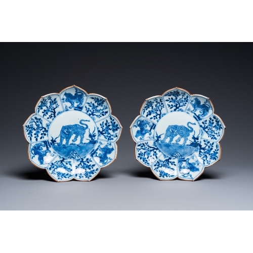 653 - A pair of Chinese blue and white lotus-shaped 'leopard' dishes, KangxiDia.: 22 cm