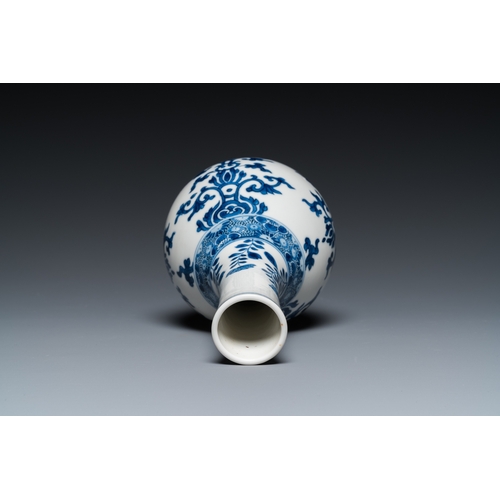 660 - A Chinese blue and white bottle vase, a tazza and a pair of famille rose cups and saucers, Kangxi an... 