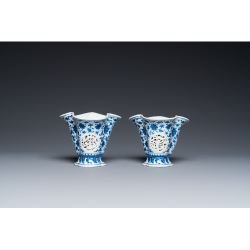 678 - A pair of Chinese reticulated and double-walled blue and white Ming-style beakers with lotus scrolls... 