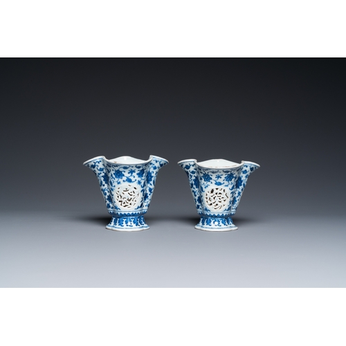 678 - A pair of Chinese reticulated and double-walled blue and white Ming-style beakers with lotus scrolls... 