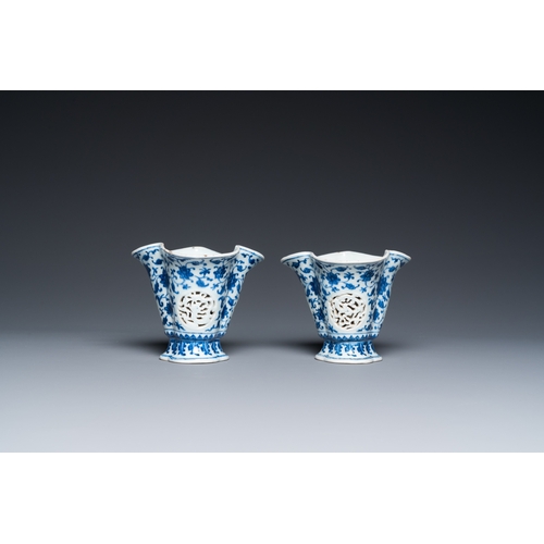 678 - A pair of Chinese reticulated and double-walled blue and white Ming-style beakers with lotus scrolls... 