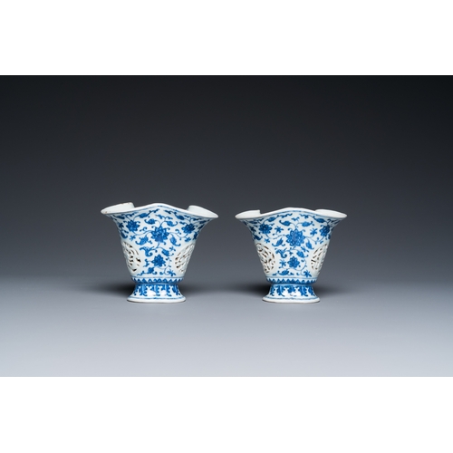 678 - A pair of Chinese reticulated and double-walled blue and white Ming-style beakers with lotus scrolls... 