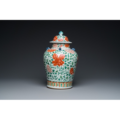 698 - A Chinese 'peony scroll' famille verte vase and cover, KangxiH.: 38 cm