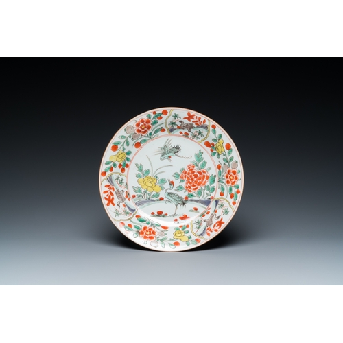 701 - A Chinese famille verte 'cranes' plate and a 'peony scroll' bowl, KangxiDia.: 22 cm (the plate) Dia.... 