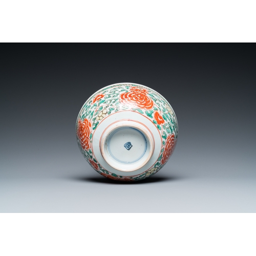 701 - A Chinese famille verte 'cranes' plate and a 'peony scroll' bowl, KangxiDia.: 22 cm (the plate) Dia.... 