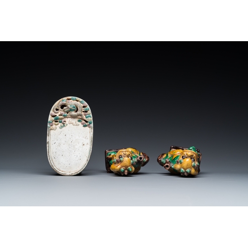 716 - A pair of Chinese sancai incense stick holders and a verte biscuit inkstone, Kangxi or laterH.: 17 c... 