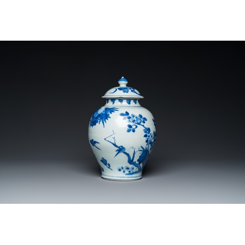 740 - A Chinese blue and white covered vase with birds among blossoming branches, Transitional periodH.: 3... 