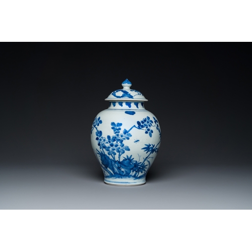 740 - A Chinese blue and white covered vase with birds among blossoming branches, Transitional periodH.: 3... 