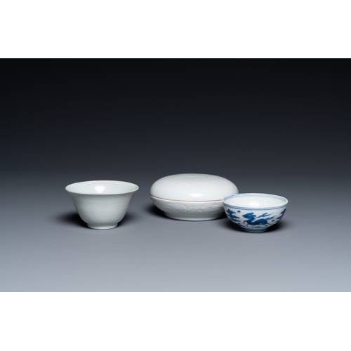 748 - A Chinese white-glazed bowl, a small blue and white bowl and a covered box with incised design, Ming... 